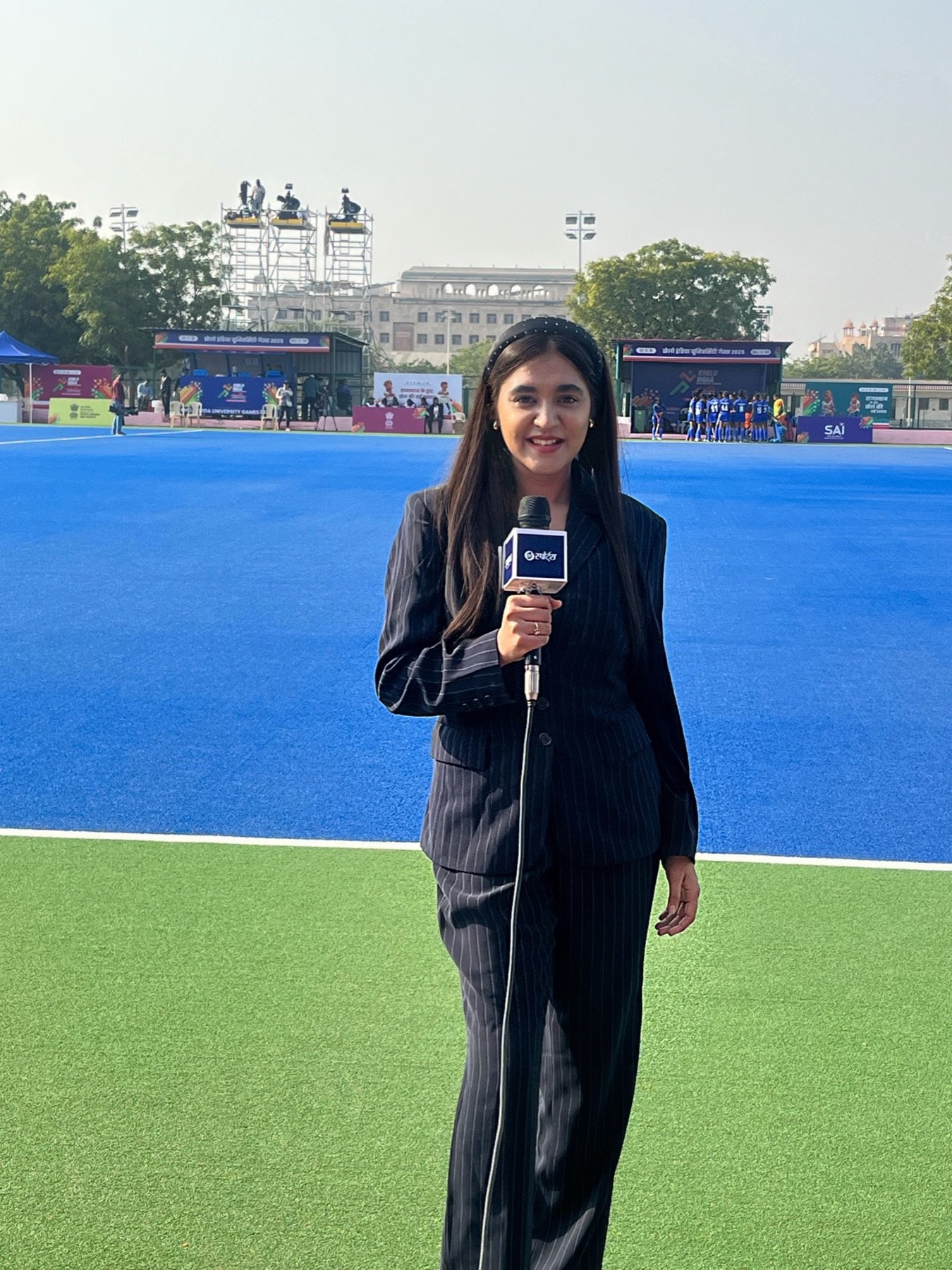 Khushi Ansari anchoring hockey coverage on the turf