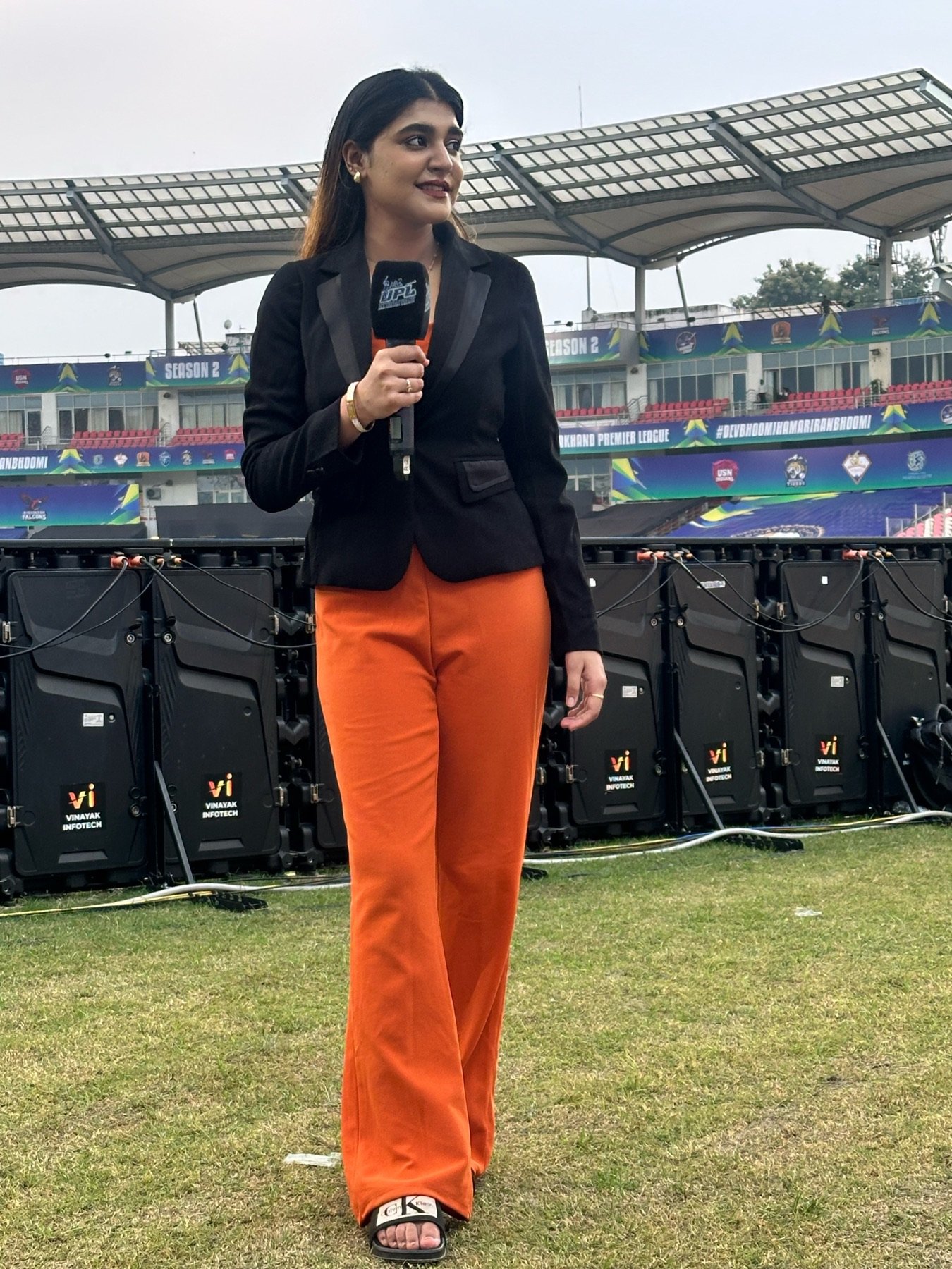 Khushi Ansari presenting pitch-side at the Uttarakhand Premier League